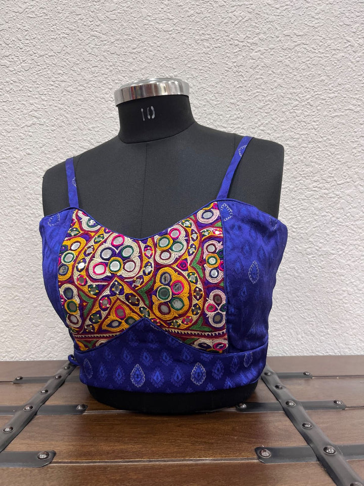 Sleeveless Navratri blouse with colorful Kutchi embroidery work
