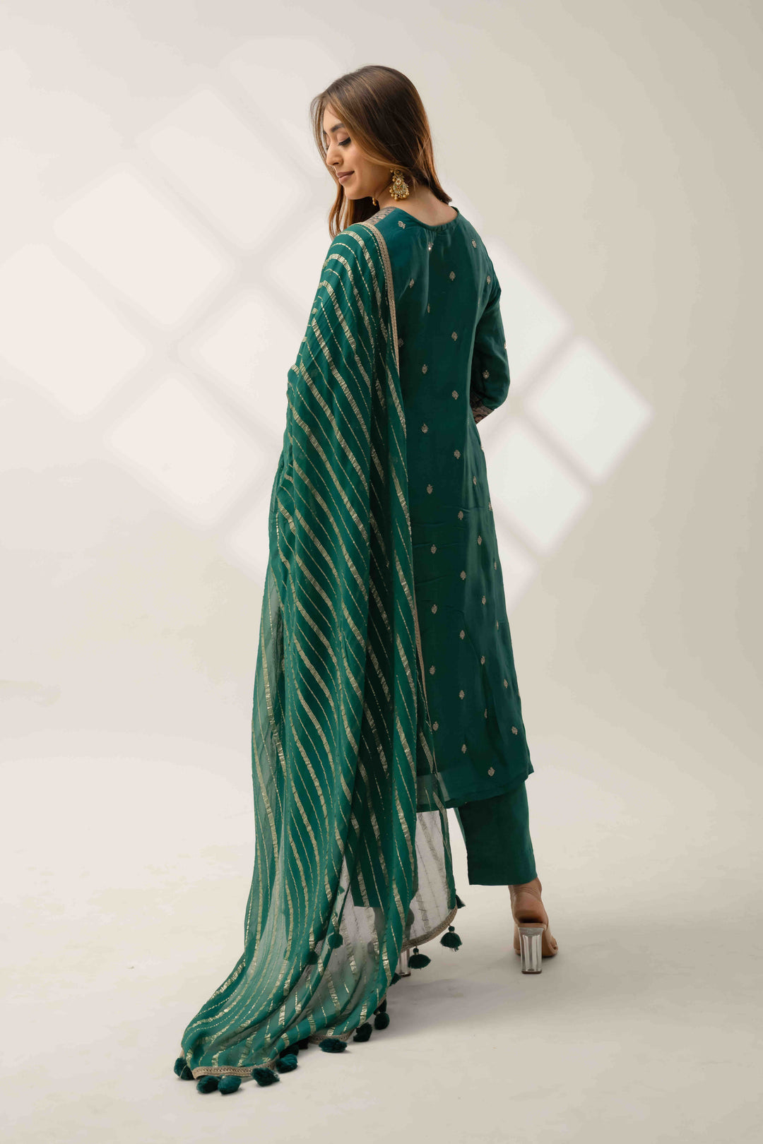 Back view of teal green A-line kurta set with silk fabric