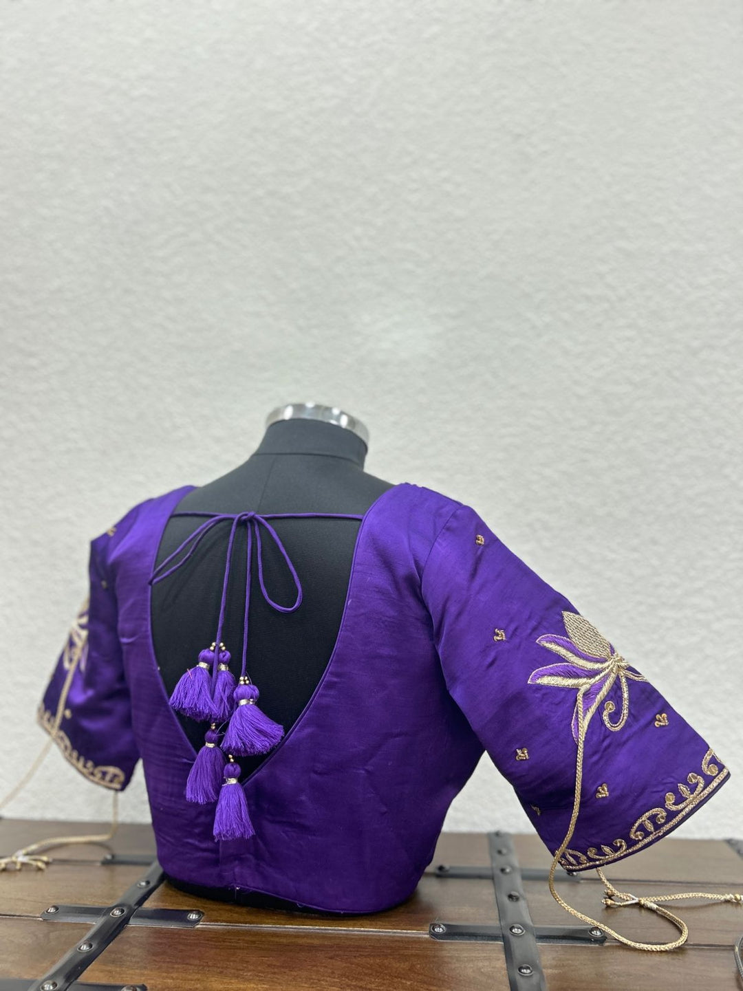 Traditional designer blouse with intricate khat hand embroidery on neckline and sleeves