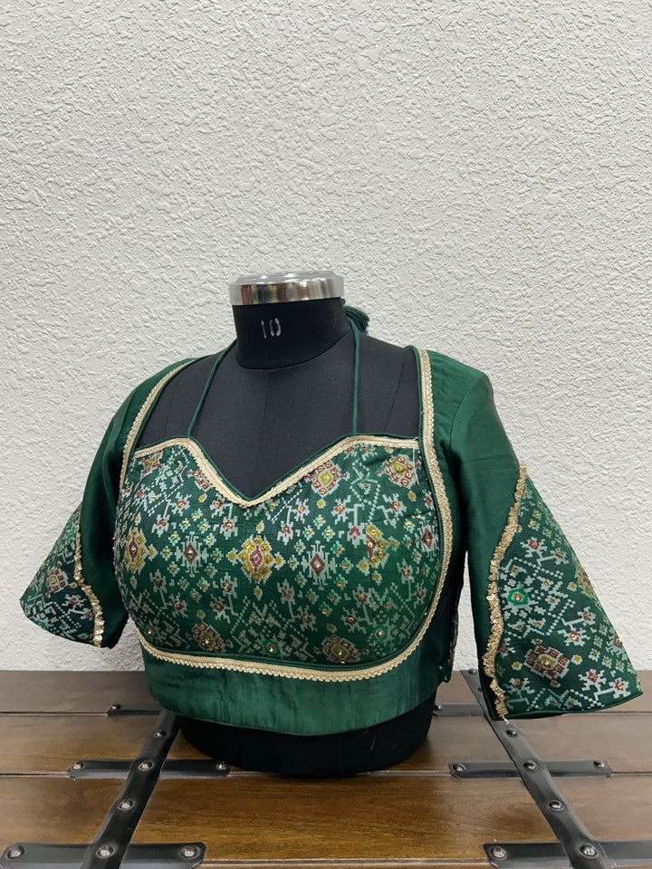 Festive blouse featuring coordinated Patola sleeve detailing and elegant finish