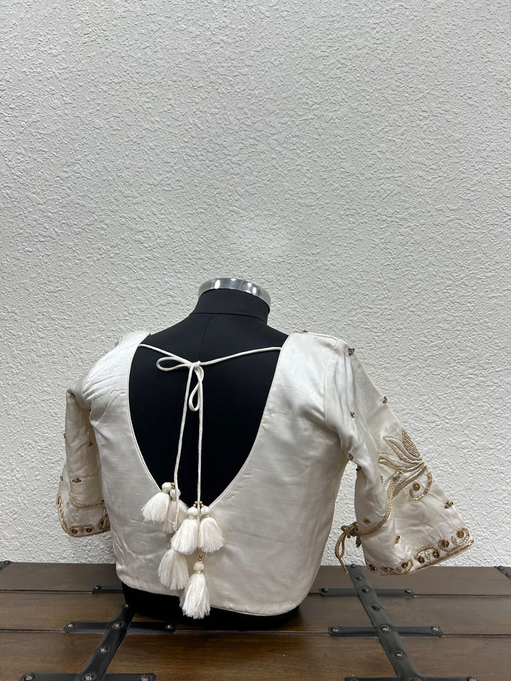 White raw silk festive blouse with delicate hand embroidery and elegant lotus motifs
