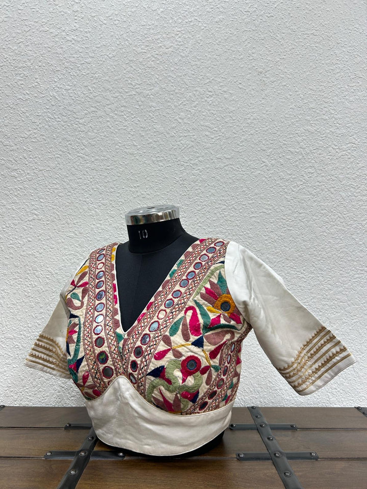  White raw silk blouse with vibrant Kutchi Aabhla patchwork detailing