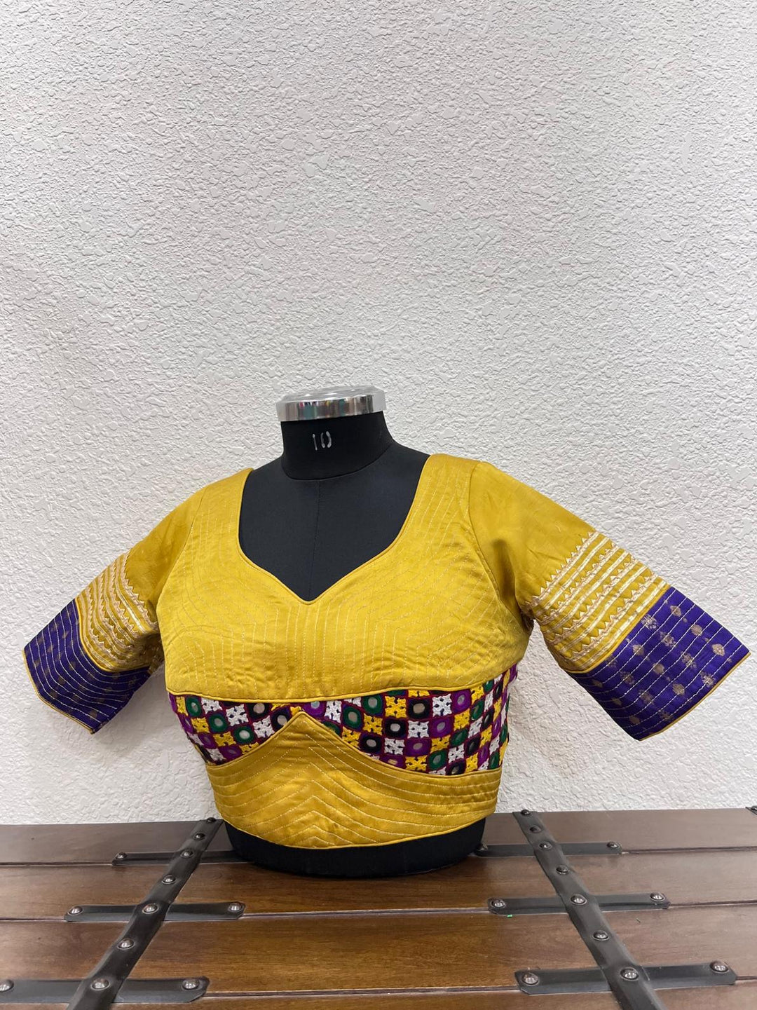 Yellow raw silk blouse with Gamthi work front and kasab sleeves