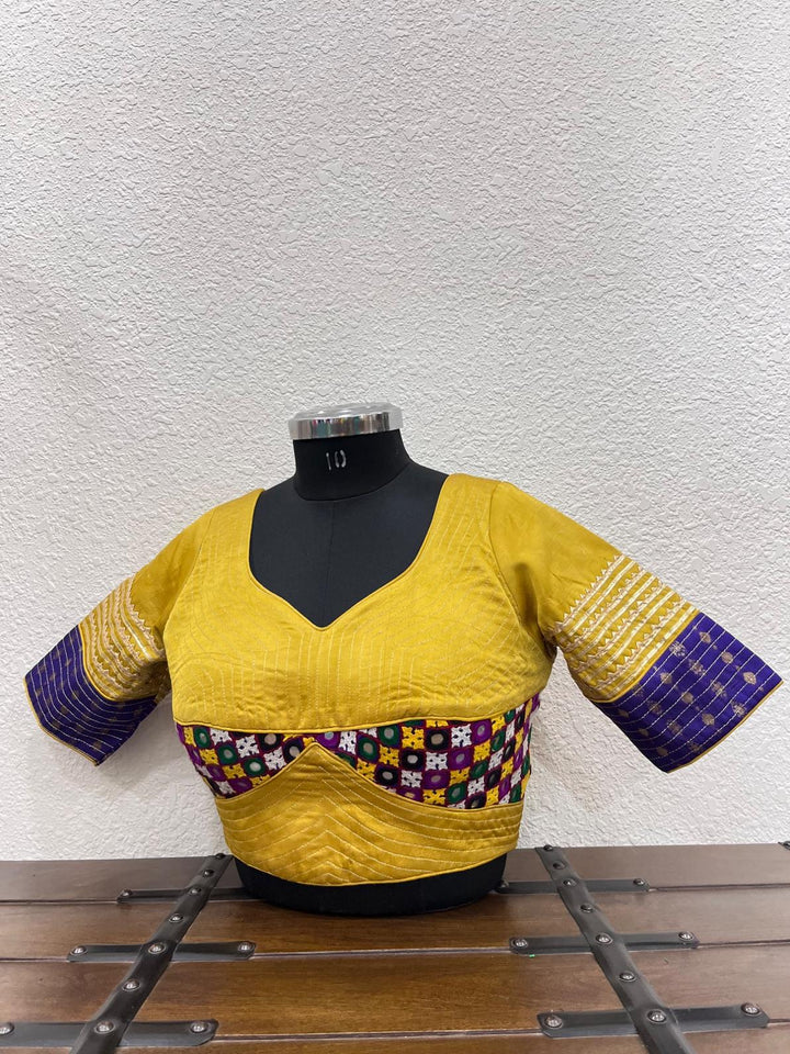 Yellow raw silk blouse with Gamthi work front and kasab sleeves