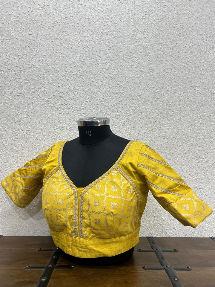 Yellow raw silk blouse with elegant lace detailing on front panel